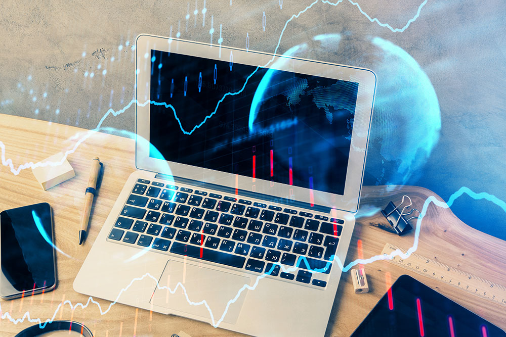 Apple Inc. products like laptop, ipad, and Destcryptophone place on a wooden table, overlaid a stock market graph and a globe color blue.